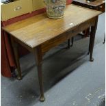 A George III mahogany pad foot side table, the rectangular top over a plain frieze centred by a