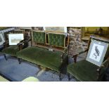 A late 19th century inlaid rosewood three piece salon suite comprising a sofa and pair of armchairs,