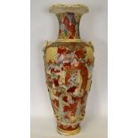 A large Japanese Satsuma style floor standing baluster vase decorated with figures under pine trees,