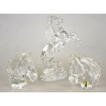 Three Waterford Crystal models:  Three horses heads, 13 cm h. and a Prancing Horse, 23.5 cm h. (3)