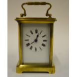 A French brass carriage clock with keyless movement and enamel dial, 14 cm high overall Condition
