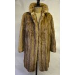 Three-quarter length smoky blond mink fur coat with neat revered collar and concealed side