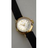 A lady's 'Regency' 9ct gold wristwatch with champagne dial and gilt batons, on black suede strap (