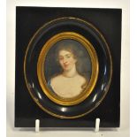 A Georgian oval portrait miniature of a young lady with pearl necklace and plunging neckline,