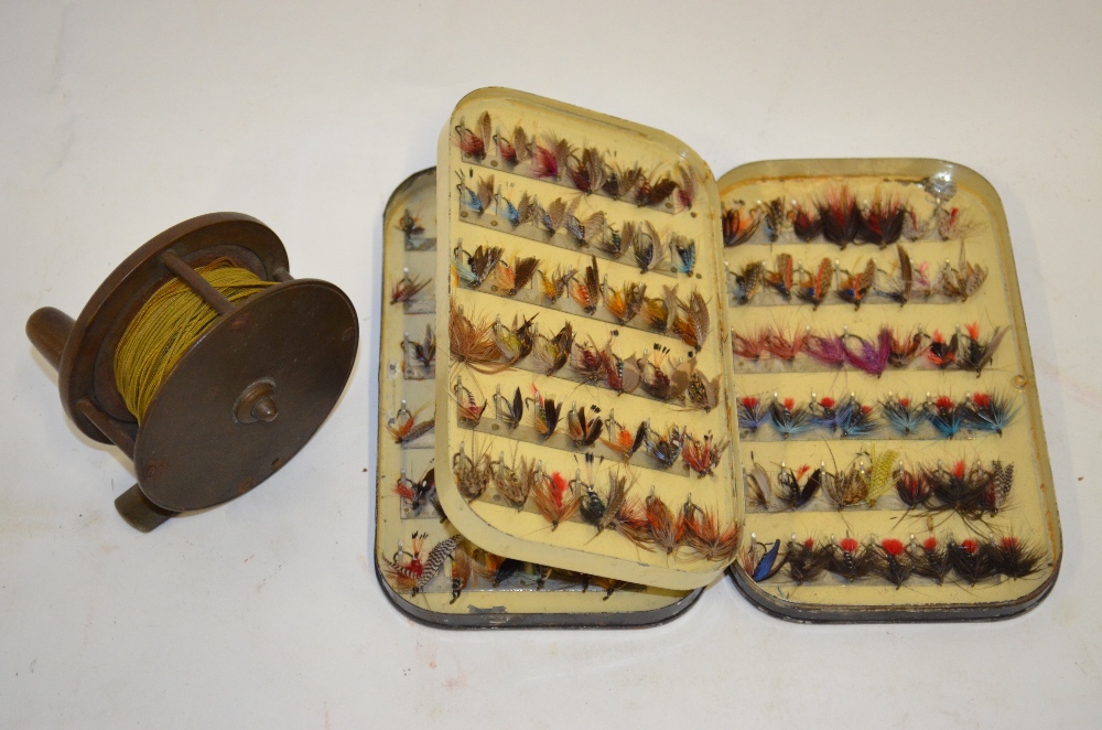 A Victorian brass 3in fly fishing reel,