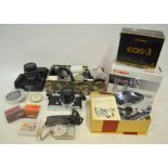 A quantity of modern camera equipment, including Canon EOS 20D digital SLR, EOS-3, 35 mm SLR and