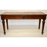 A mid 19th century mahogany serving table having a moulded edged rectangular top over a pair of