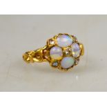 An antique Victorian opal and rose diamond cluster ring with scroll style shoulders Condition Report