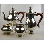A heavy quality silver four-piece tea service including hot water jug, baluster form with domed
