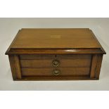 A Walker & Hall oak canteen containing a