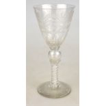 A Regency coin goblet having a thumb nail cut funnel bowl engraved with a continuous frieze of Adams