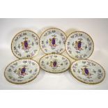 A set of nine 19th century French armorial plates in the Chinese famille rose style, 25.5 cm (9)