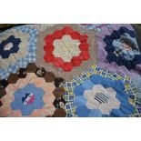 1940's hexagonally worked cotton patchwork quilt, multi-coloured in assorted fabrics, 160 cm x 232