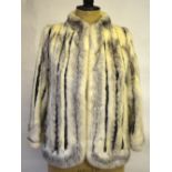 Off-white, shaded grey mink fur box-shaped jacket inset with vertical inserts of black leather, 45