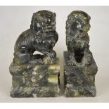 A pair of Chinese hardstone dogs of Fo seated on rectangular plinths, late 19th century, 26 cm h.