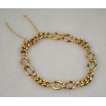 A 9ct yellow gold fancy curb bracelet wi