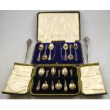A cased set of silver teaspoons with ton