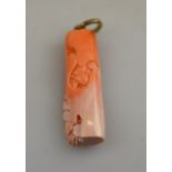 A Chinese coral pendant carved with flow