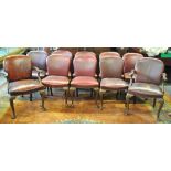 A set of ten brass studded red leather dining chairs, raised on moulded cabriole front legs