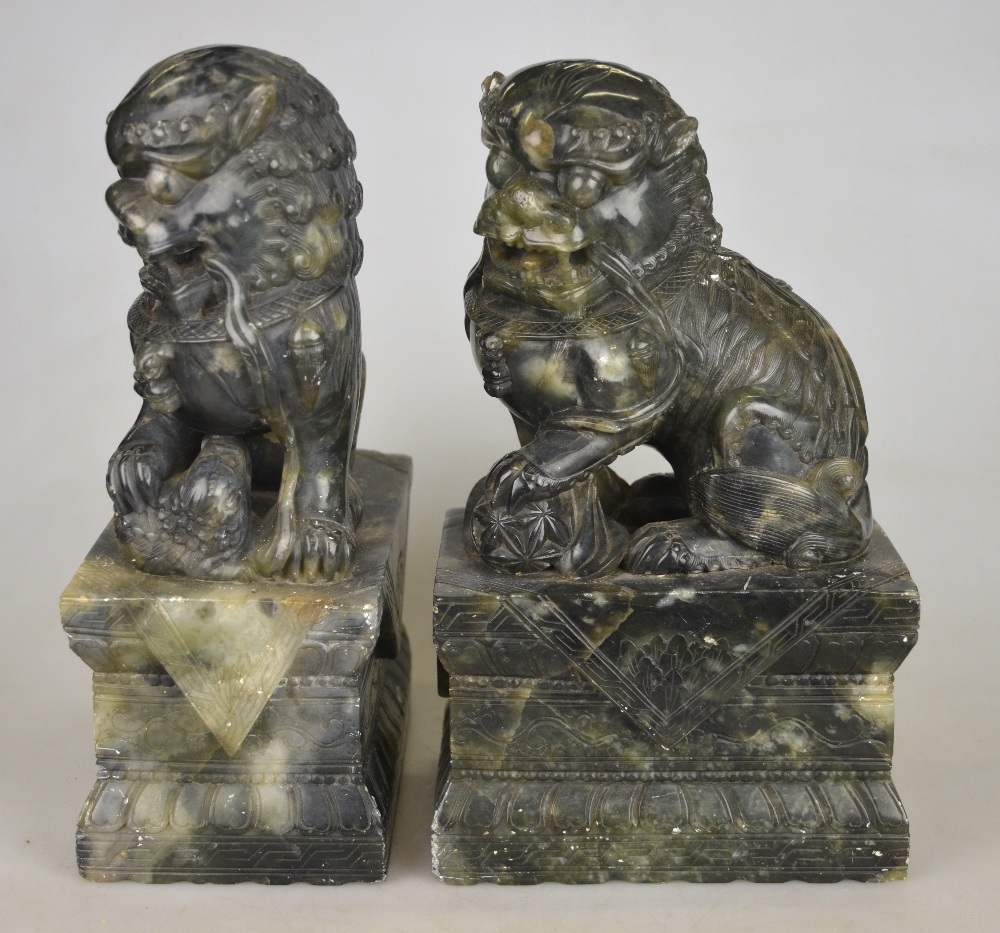 A pair of Chinese hardstone dogs of Fo seated on rectangular plinths, late 19th century, 26 cm h. - Image 2 of 4