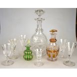 A small collection of glass comprising:  a small wine glass with trumpet shaped facetted bowl,