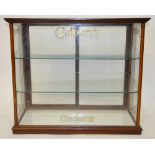 Cadbury's Chocolates - a retailers glazed counter top display cabinet with glass shelves and sliding