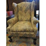 A George II style wingback armchair, tra