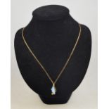 A contemporary style opal pendant set wi