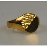 A 9ct yellow gold signet ring, the head half textured, approx 5g Condition Report The ring is