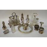 Two cruet sets on electroplated stands,