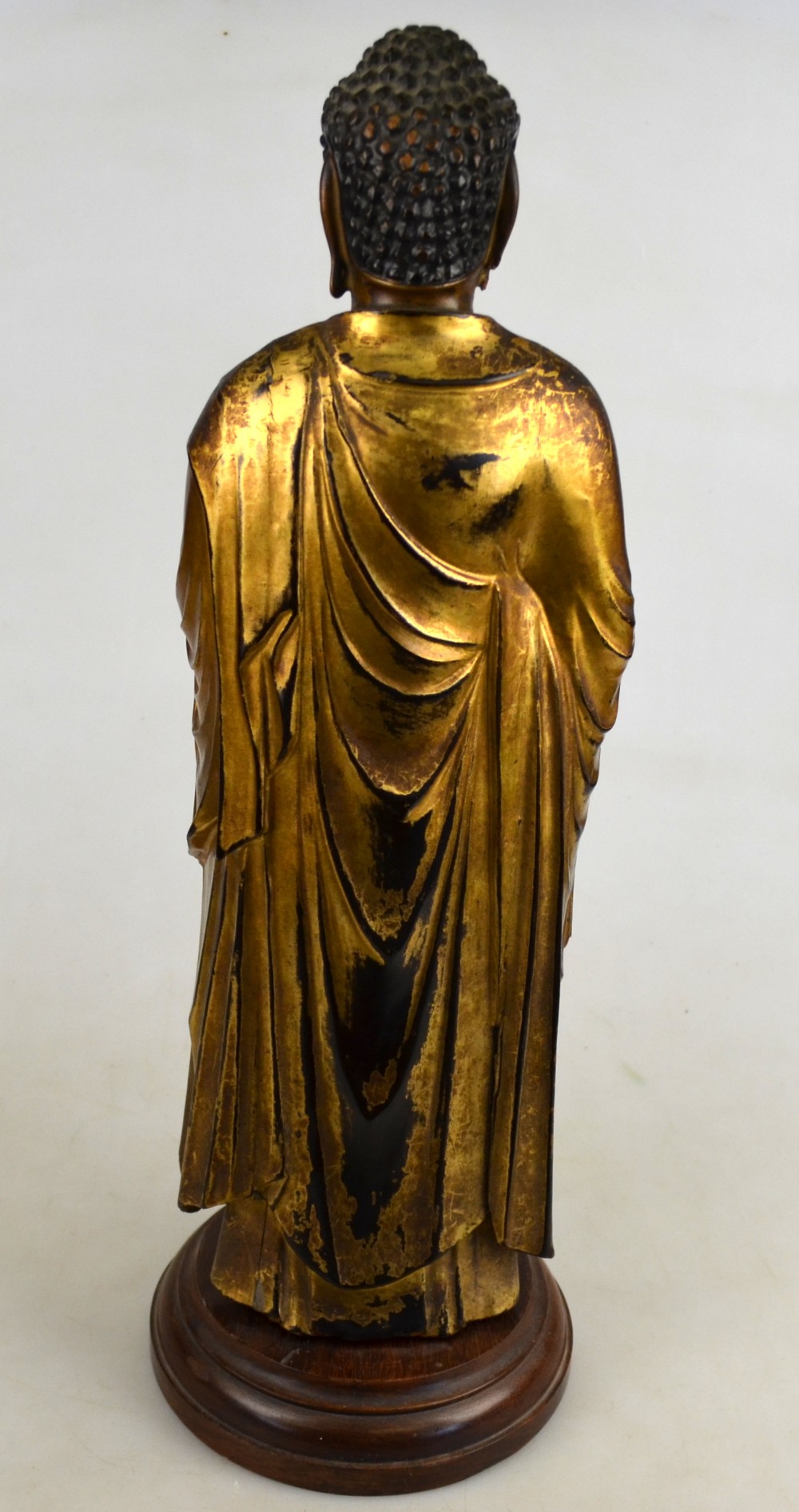 A Japanese 18th century carved wood and gold lacquer figure of a standing Buddha, 37 cm high, on a - Image 2 of 4