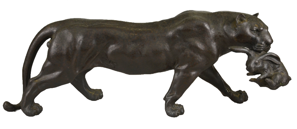 A Japanese bronze model of a leopard with a hare in his mouth, Meiji, seal mark to underside, 47.5