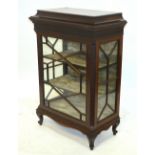 An Edwardian Chippendale display cabinet