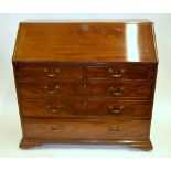 A George III mahogany bureau, the fall e