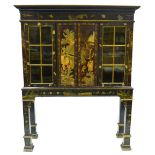 A 19th century Chinese black lacquered cabinet decorated overall with gilt and polychrome, the