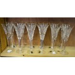 One dozen Waterford Crystal champagne flutes, five pairs designed to commemorate the five