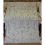 A crewel work throw decorated with stylised flowers, pale green and cream with pale red thread,
