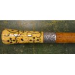 A late Victorian malacca walking cane, the ivory pommel with nail-punch decoration and silver