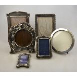 An Edwardian Art Nouveau style embossed silver easel photograph frame, Walker & Hall, Sheffield