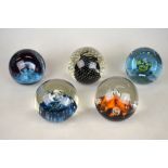 Five Caithness glass paperweights - Moonflower, Quicksilver, Odessy, Spinning and Cauldron, all