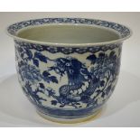 A Chinese blue and white large jardiniere decorated with two writhing dragons amidst peonies, late
