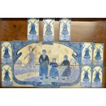 A series of six Art Nouveau tiles depicting Dutch children in a landscape with a windmill within a