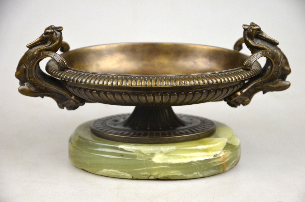 A bronze shallow dish in the form of a w