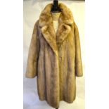 Shadowed blond mink fur coat with deep r