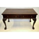 A late 19th century Chippendale style writing table, the rectangular top with tooled leather surface