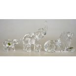 Three Waterford Crystal models:  Elephant, 18 cm h., Calf Elephant, 7 cm, Lion, 11.5 cm h. (3)