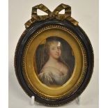 A 19th century oval enamel portrait miniature of a Renaissance lady in gilt mount and parcel gilt