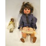 An Armand Marseille 996 A3M bisque-headed girl doll with brown wig, closing blue eyes and open mouth