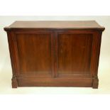Victorian mahogany cabinet having a pair of panelled doors flanked by gadrooned pillars enclosing