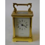 A brass carriage timepiece by H. Samuel,